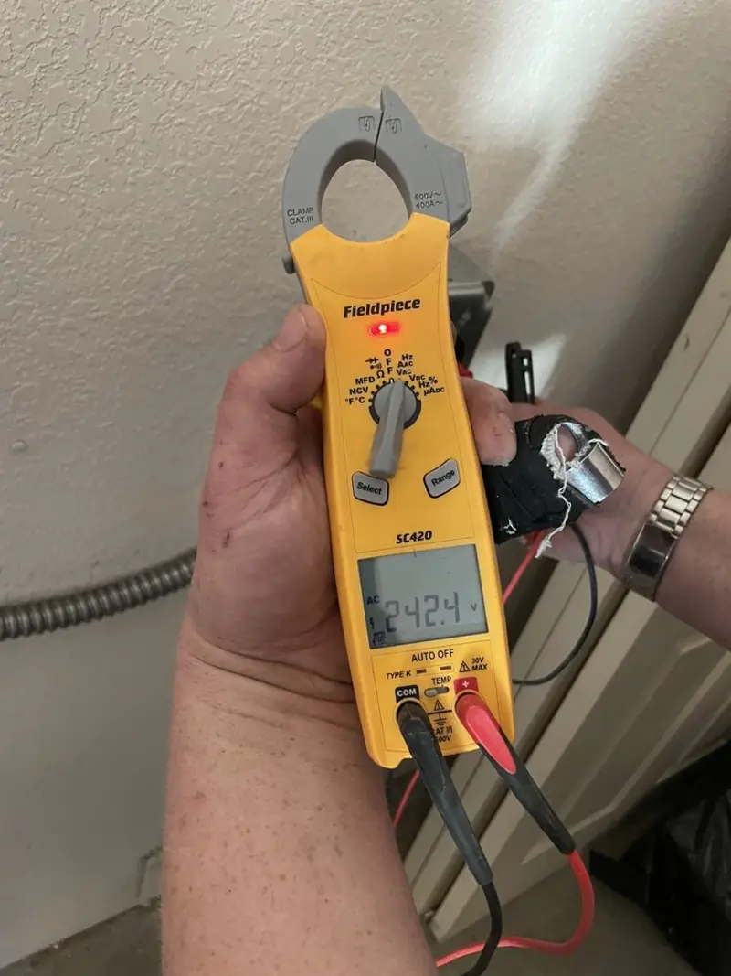 Voltage testing with clamp meter during Generator Installation in Allouez